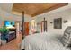 Luxurious primary bedroom features fireplace, television, and ensuite bathroom at 6699 S Robb St, Littleton, CO 80127