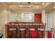 This well-stocked wet bar includes overhead lighting and unique wood work at 6699 S Robb St, Littleton, CO 80127