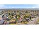 Overhead view of a home nestled among trees with mountain views, situated in a vibrant residential neighborhood at 10429 Quivas St, Northglenn, CO 80234