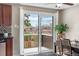 Dining area features glass doors leading to the backyard and ample natural light at 10429 Quivas St, Northglenn, CO 80234