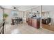 Open-concept dining area features tile flooring and is adjacent to the kitchen and living room at 10429 Quivas St, Northglenn, CO 80234