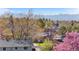 A home with lush trees and mountain views showcasing the surrounding neighborhood at 10429 Quivas St, Northglenn, CO 80234