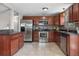 A well-lit kitchen featuring stainless steel appliances and granite countertops at 10429 Quivas St, Northglenn, CO 80234