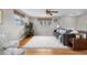 Spacious living room with hardwood floors, neutral paint, large windows, and ceiling fan with great natural light at 10429 Quivas St, Northglenn, CO 80234
