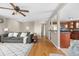Bright living room with hardwood floors open to the dining and kitchen areas at 10429 Quivas St, Northglenn, CO 80234