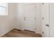 A simple and clean entryway featuring light wood-look flooring and white walls at 1871 Water Birch Way, Castle Rock, CO 80108