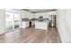 Modern kitchen featuring white cabinets, stainless steel appliances, and an eat-in island at 1871 Water Birch Way, Castle Rock, CO 80108