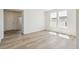 Inviting living room with hardwood floors, lots of natural light, and neutral paint colors at 1871 Water Birch Way, Castle Rock, CO 80108