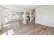 Open-concept living space featuring hardwood floors, large windows, and modern finishes at 1871 Water Birch Way, Castle Rock, CO 80108