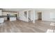 Bright and open-concept living space with hardwood floors and abundant natural light at 1871 Water Birch Way, Castle Rock, CO 80108