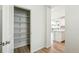 Walk-in pantry with wire shelving, and wood-look floors near the kitchen area at 1871 Water Birch Way, Castle Rock, CO 80108