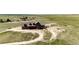 Drone's eye view of home featuring a meandering driveway, beautiful rock outcroppings, and natural surroundings at 2710 Rustlers Canyon Loop, Elizabeth, CO 80107