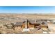 Aerial view showcasing the home's layout on a large lot with outdoor features at 2710 Rustlers Canyon Loop, Elizabeth, CO 80107