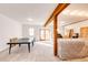 Unfinished basement space with wood beams and natural light, ready to be customized at 2710 Rustlers Canyon Loop, Elizabeth, CO 80107