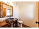 Unique rustic bathroom with stone vessel sink and wooden vanity at 2710 Rustlers Canyon Loop, Elizabeth, CO 80107
