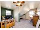 Bright bedroom features a fan, closet, and carpet flooring at 2710 Rustlers Canyon Loop, Elizabeth, CO 80107