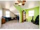 Inviting bedroom with a ceiling fan, carpet floor, and large windows at 2710 Rustlers Canyon Loop, Elizabeth, CO 80107