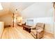Bonus room offers natural light, hardwood floors, and a cozy atmosphere perfect for relaxation at 2710 Rustlers Canyon Loop, Elizabeth, CO 80107