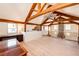 Open bonus room with exposed beams and wood floors at 2710 Rustlers Canyon Loop, Elizabeth, CO 80107