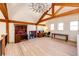 Spacious bonus room featuring wood floors, a vaulted ceiling, and natural light at 2710 Rustlers Canyon Loop, Elizabeth, CO 80107