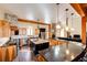 Gourmet kitchen boasts a large island, stone accents, stainless appliances, and ample countertop space at 2710 Rustlers Canyon Loop, Elizabeth, CO 80107
