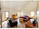 Inviting bedroom with vaulted ceilings, wood floors, large windows, and a cozy sitting area, perfect for relaxation at 2710 Rustlers Canyon Loop, Elizabeth, CO 80107
