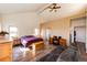 Comfortable bedroom with ample natural light, a cozy couch, and a work desk for added convenience at 2710 Rustlers Canyon Loop, Elizabeth, CO 80107