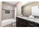 Beautiful bathroom featuring a tiled shower-tub combination, granite countertop, and wood cabinets at 16549 Prospect Ln, Broomfield, CO 80023