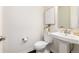 Neat half-bathroom features modern fixtures, decorative art, and a pedestal sink at 16549 Prospect Ln, Broomfield, CO 80023