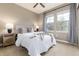 Cozy bedroom featuring a ceiling fan, two windows and natural decor at 16549 Prospect Ln, Broomfield, CO 80023