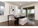 Inviting dining area with a dark wood table, stylish seating, and a sliding door leading to an outdoor patio at 16549 Prospect Ln, Broomfield, CO 80023