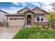 Charming two-story home with stone accents, manicured lawn, and a two-car garage at 16549 Prospect Ln, Broomfield, CO 80023
