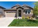 Charming single-Gathering home with a stone facade, manicured lawn, and an attached two-car garage at 16549 Prospect Ln, Broomfield, CO 80023