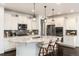 Modern kitchen featuring a granite island, stainless steel appliances, and pendant lighting at 16549 Prospect Ln, Broomfield, CO 80023