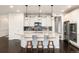 Modern kitchen featuring a granite island, stainless steel appliances, and pendant lighting at 16549 Prospect Ln, Broomfield, CO 80023