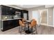 Kitchen area featuring modern stainless steel appliances and a table for seating at 16549 Prospect Ln, Broomfield, CO 80023