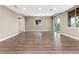 Spacious living room features wood floors, recessed lighting, and access to outdoor living space at 16549 Prospect Ln, Broomfield, CO 80023