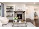 Inviting living room boasts a fireplace, floating shelves, modern decor and a stylish rug at 16549 Prospect Ln, Broomfield, CO 80023