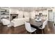 Open floor plan featuring a cozy living area with a fireplace, adjacent to a dining area and a modern kitchen at 16549 Prospect Ln, Broomfield, CO 80023