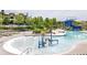 Community water park featuring colorful slides, interactive water features, and a large pool at 16549 Prospect Ln, Broomfield, CO 80023