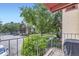 Private balcony offers a view of mature trees and community landscaping at 12131 Melody Dr # 201, Denver, CO 80234