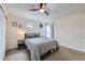 Bedroom with window, carpet, ceiling fan, and good natural light at 12131 Melody Dr # 201, Denver, CO 80234