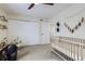 Bedroom featuring a crib, large closet, and baby toys at 12131 Melody Dr # 201, Denver, CO 80234