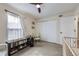 Bedroom features carpet, ceiling fan, window with natural light, and baby toys at 12131 Melody Dr # 201, Denver, CO 80234