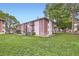 Building exterior featuring multiple units, balconies, and landscaped grounds at 12131 Melody Dr # 201, Denver, CO 80234