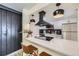 Beautiful kitchen with stainless steel appliances, white cabinets, decorative backsplash, and breakfast bar with seating at 12131 Melody Dr # 201, Denver, CO 80234