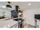 Updated kitchen featuring white countertops, stainless steel appliances, and stylish pendant lighting at 12131 Melody Dr # 201, Denver, CO 80234