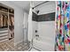 Tiled shower and closet space in this updated bathroom with unique design features at 1270 S Lowell Blvd, Denver, CO 80219