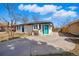 Bright and modern single-story home featuring a new concrete driveway and freshly painted exterior at 1270 S Lowell Blvd, Denver, CO 80219