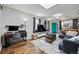 Inviting living room with skylight, hardwood floors, modern furnishings, and stylish décor at 1270 S Lowell Blvd, Denver, CO 80219